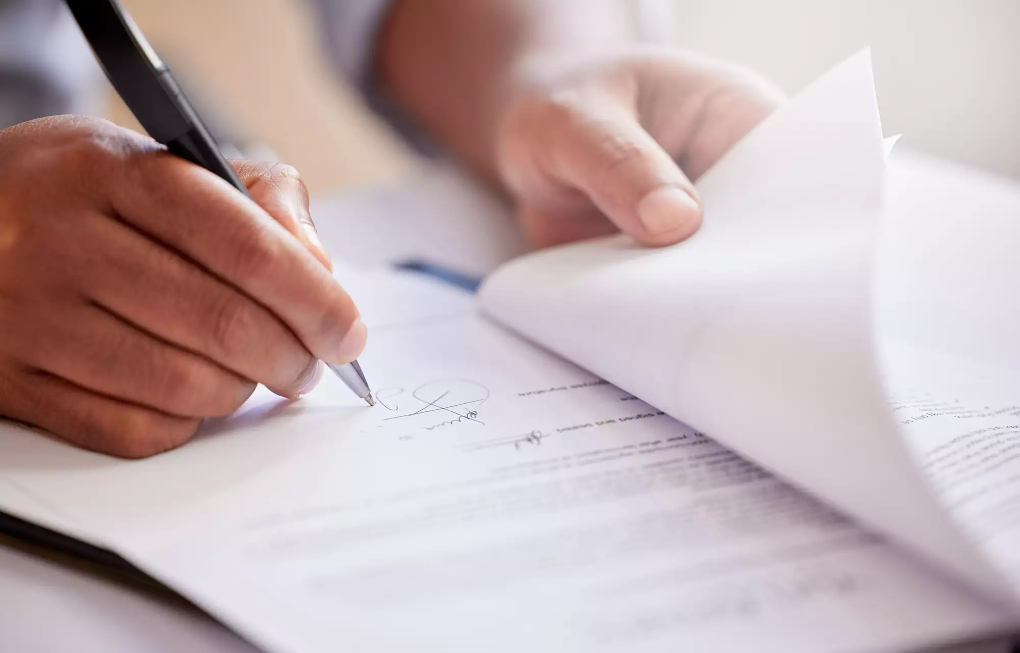 Man signing legal documents